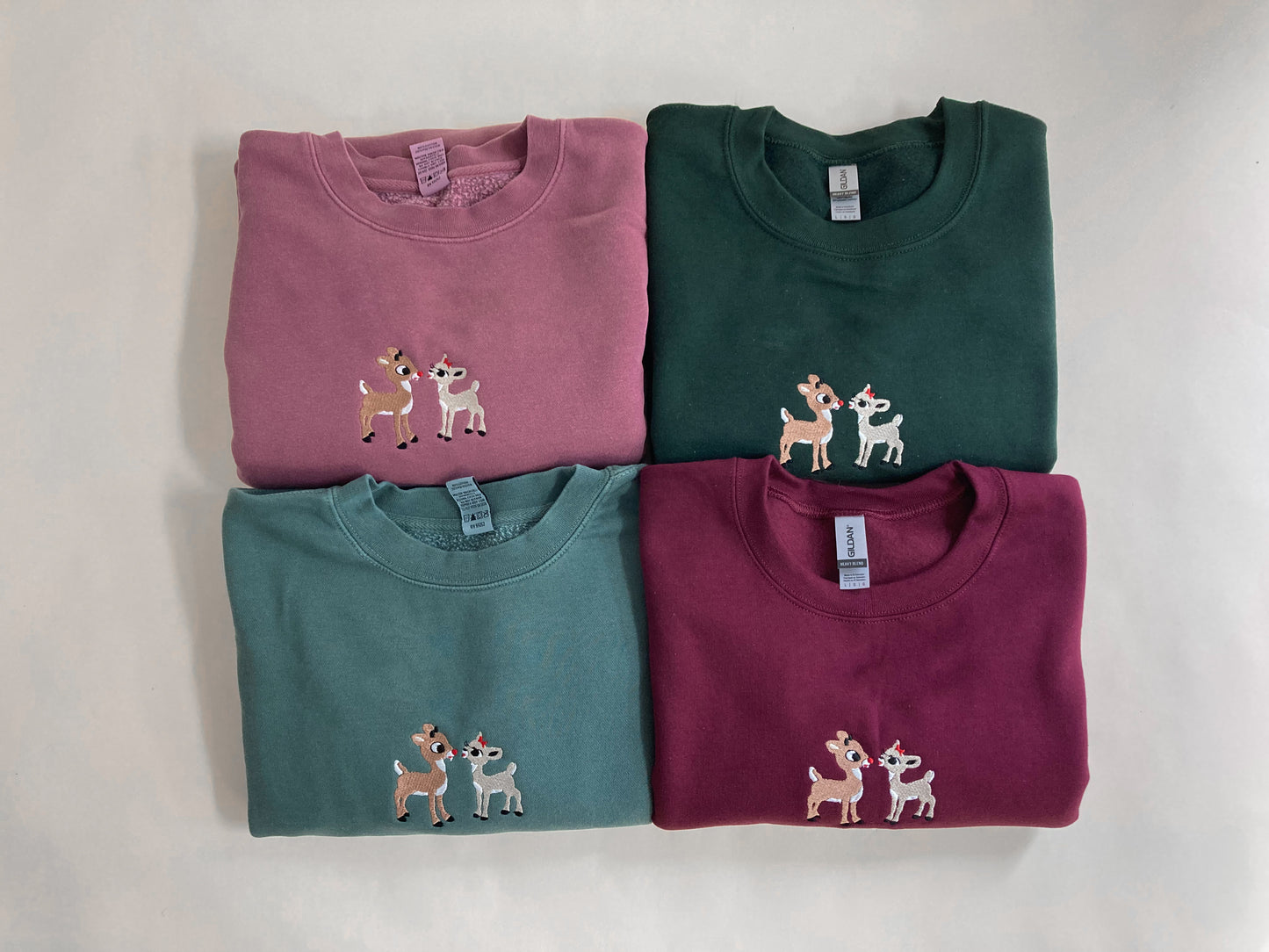 Rudolph and Clarise Adult Embroidered Sweatshirt