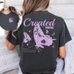 Back and front of shirt feature a butterfly in purple and words created with a purpose referencing Romans 8:28