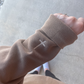 Christian cross embroidered on sweatshirt wrist
