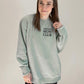 Sweatshirt featuring minivan mom club text over left chest
